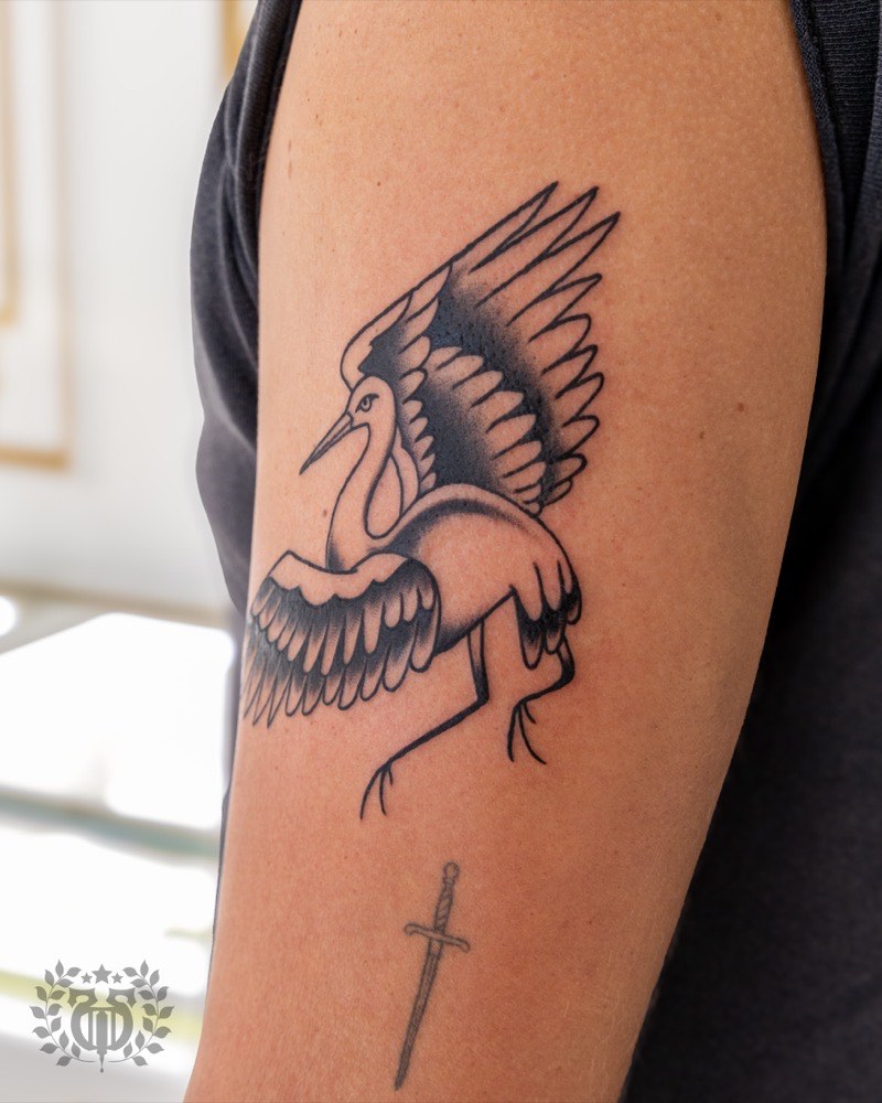 Illustrative blackwork tattoo — woodcut aesthetic