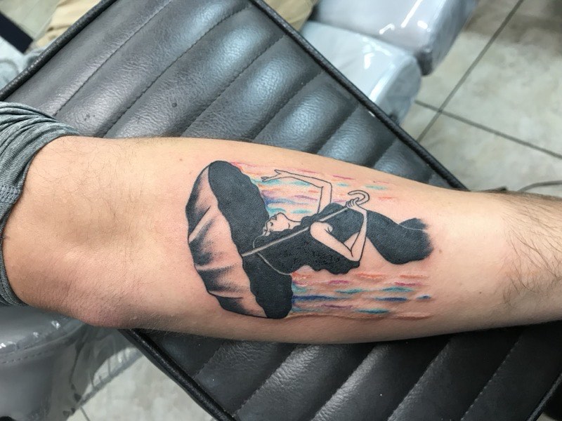 Blackletter blackwork script tattoo