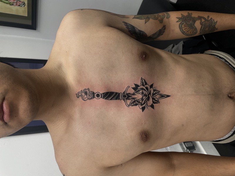 Blackwork tattoo — large-scale solid fill sleeve