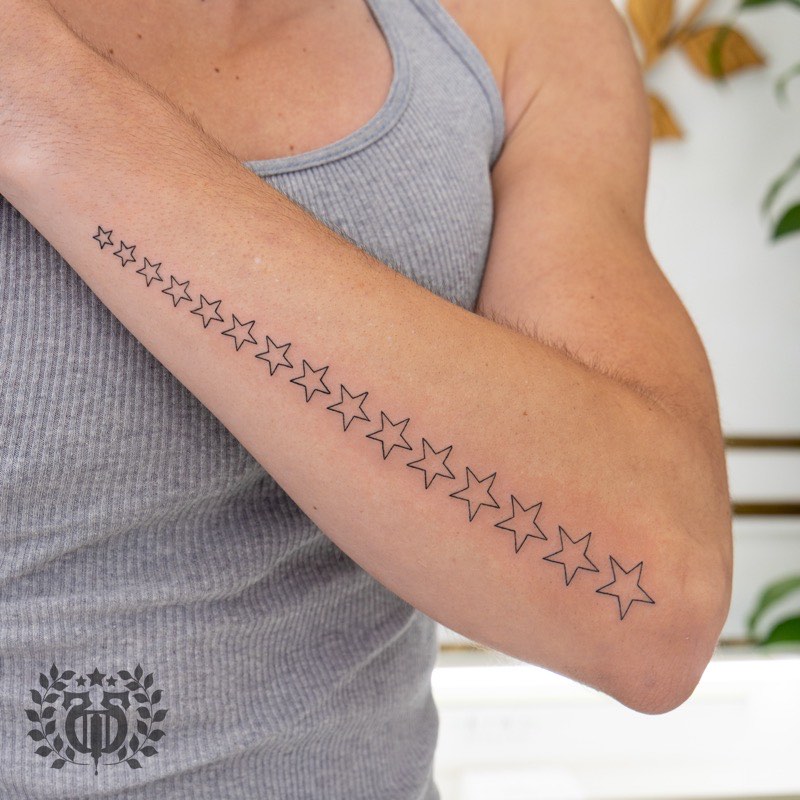 Color tattoo detail — saturated red and green shading