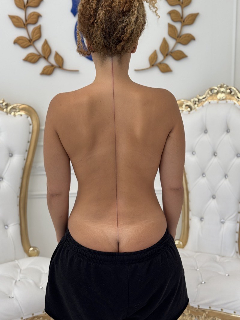 Minimalist tattoo — geometric nape piece