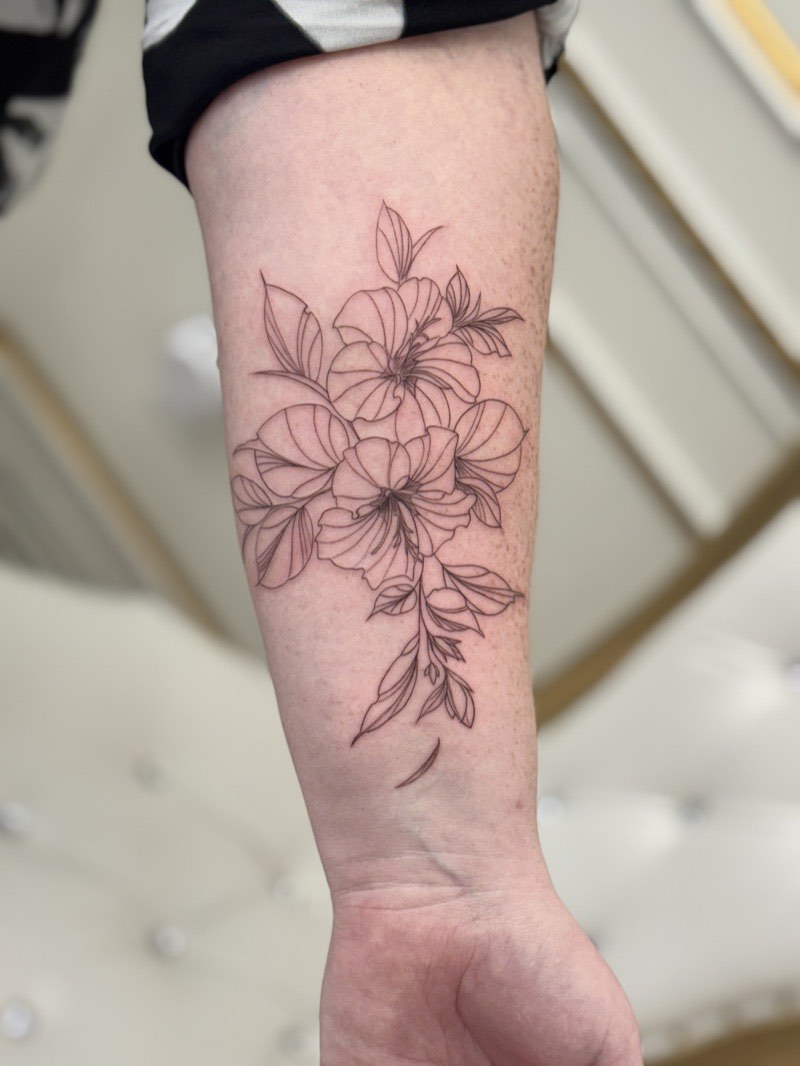 Minimalist tattoo detail — single-line contour on inner forearm