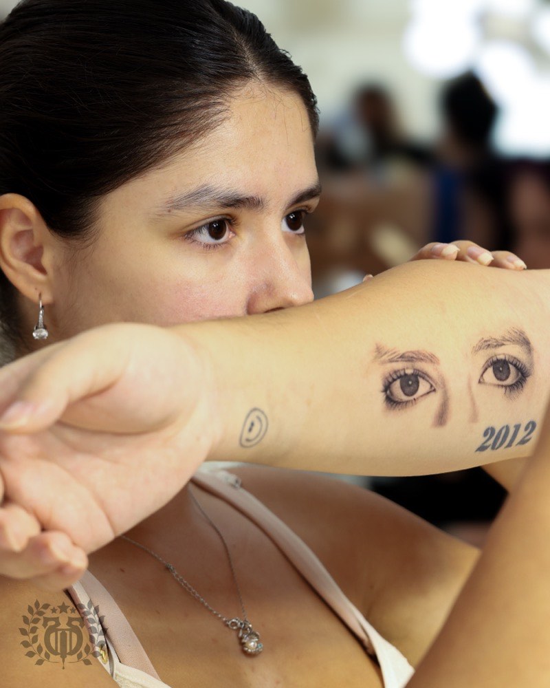 Realism portrait tattoo — human face rendered in black and gray