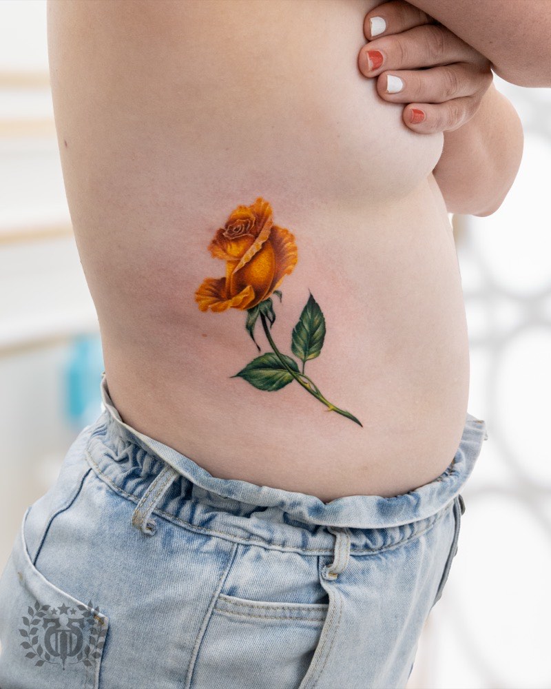 Japanese cherry blossom tattoo — sakura petals drifting through wind bars