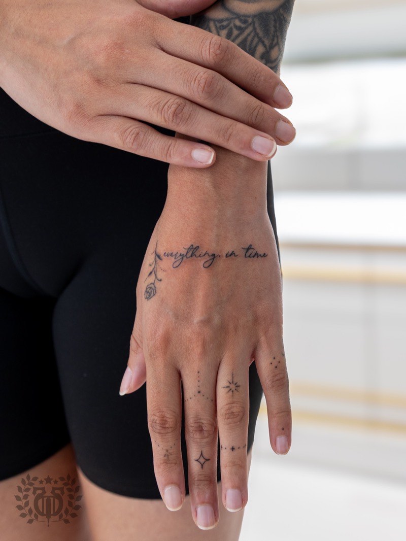 Single-word mantra tattoo in bold lettering