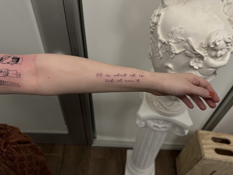 Family saying script tattoo