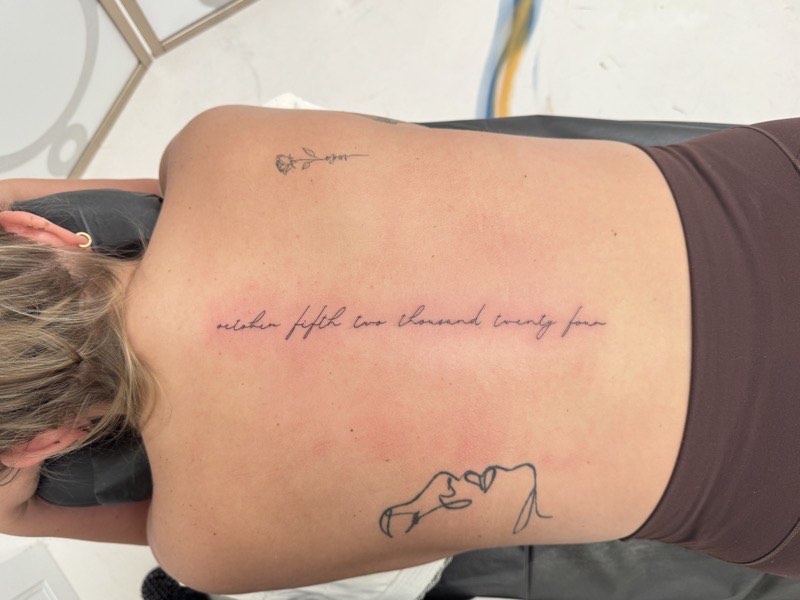 Religious scripture tattoo in traditional banner