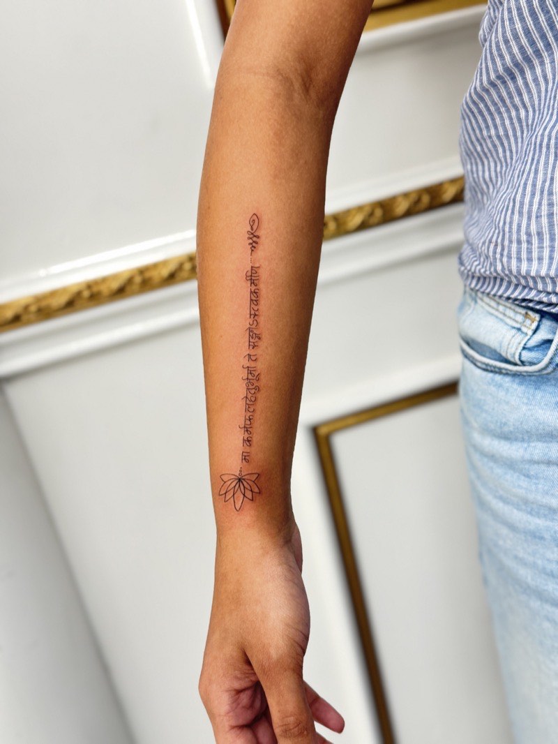 Chicano script tattoo with flowing hairlines