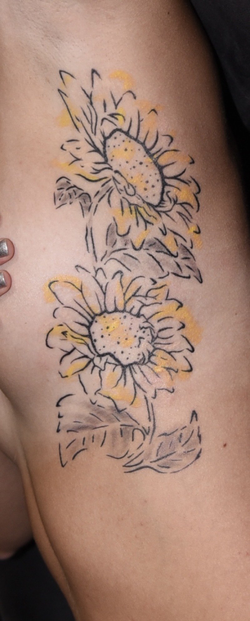 Watercolor tattoo detail — wash technique with splash