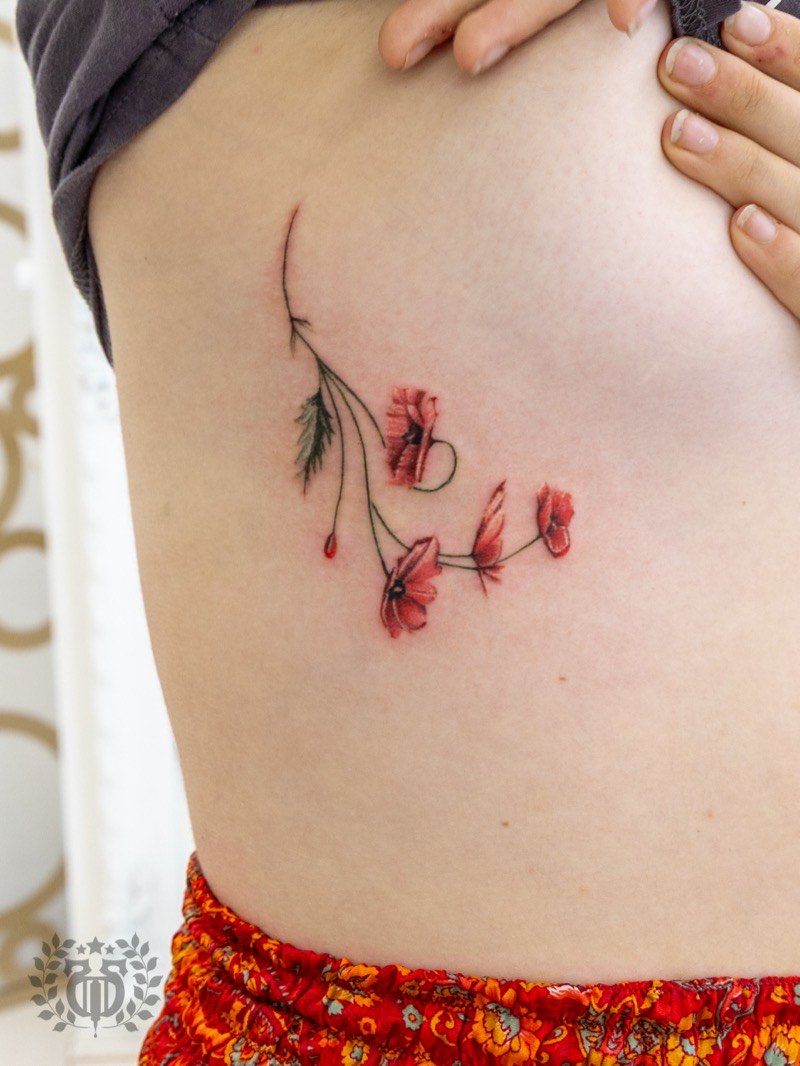 Watercolor bird tattoo — hummingbird with wing dissolution