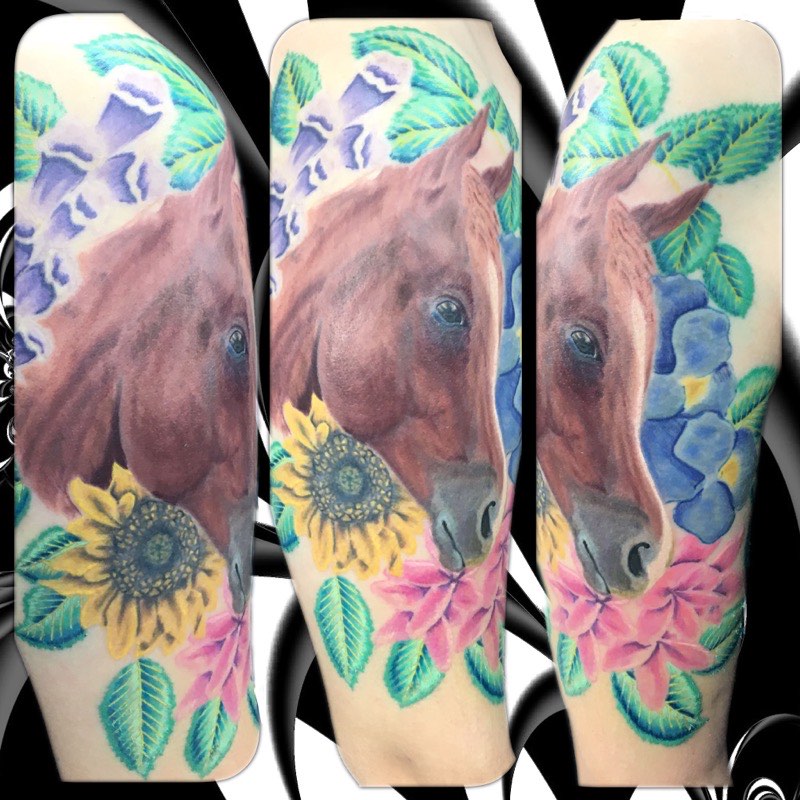 Watercolor wolf tattoo — structural linework dissolving into color
