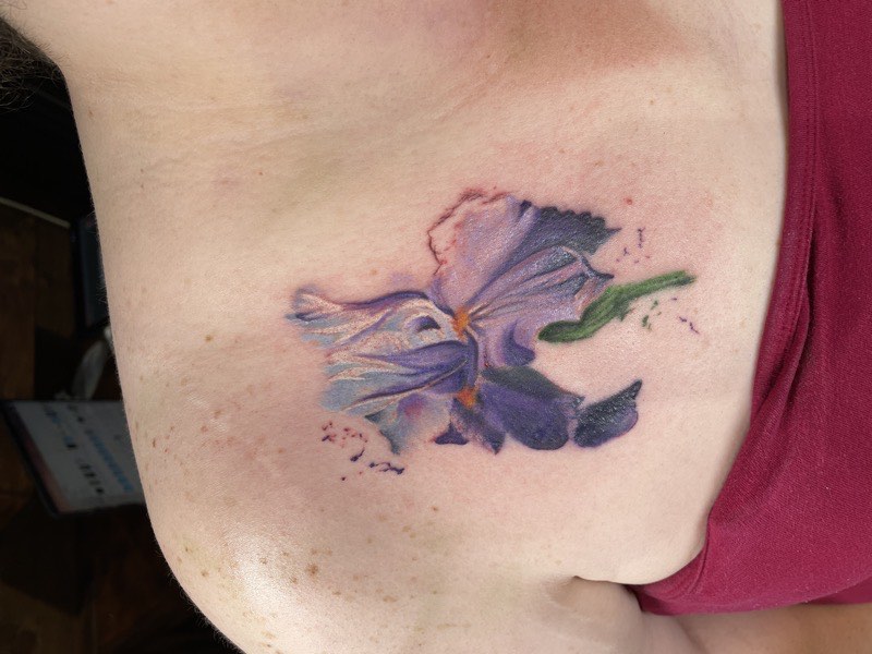 Watercolor butterfly tattoo — wings rendered in color wash
