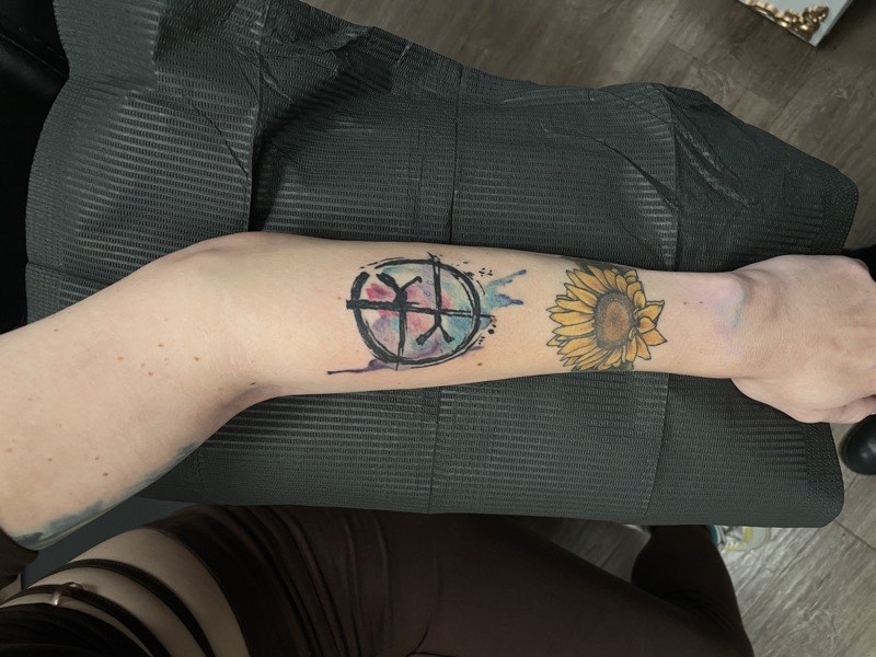 Watercolor tattoo — floral piece with splash dissolution
