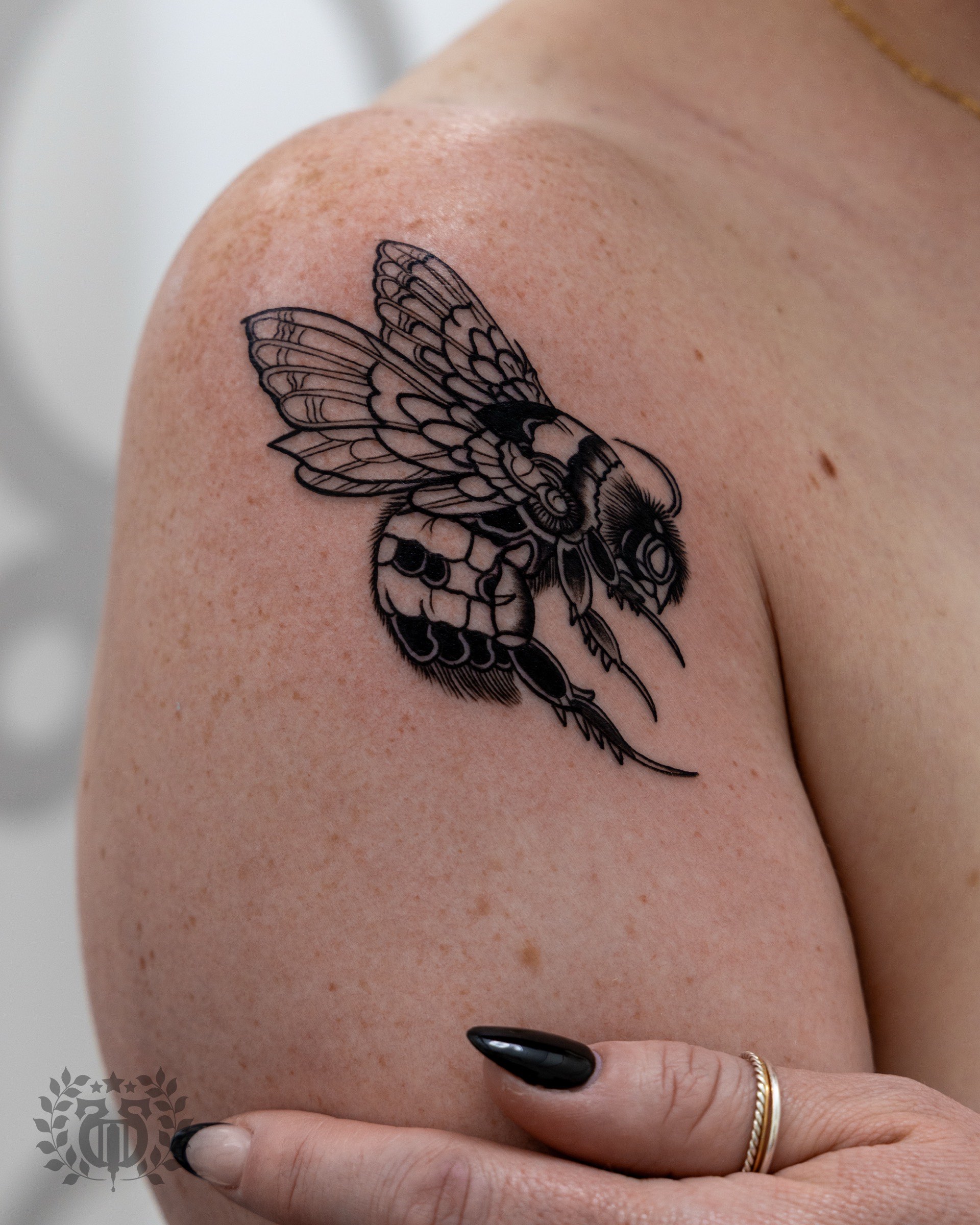 Blackwork tattoo detailed bumblebee on shoulder in Los Angeles