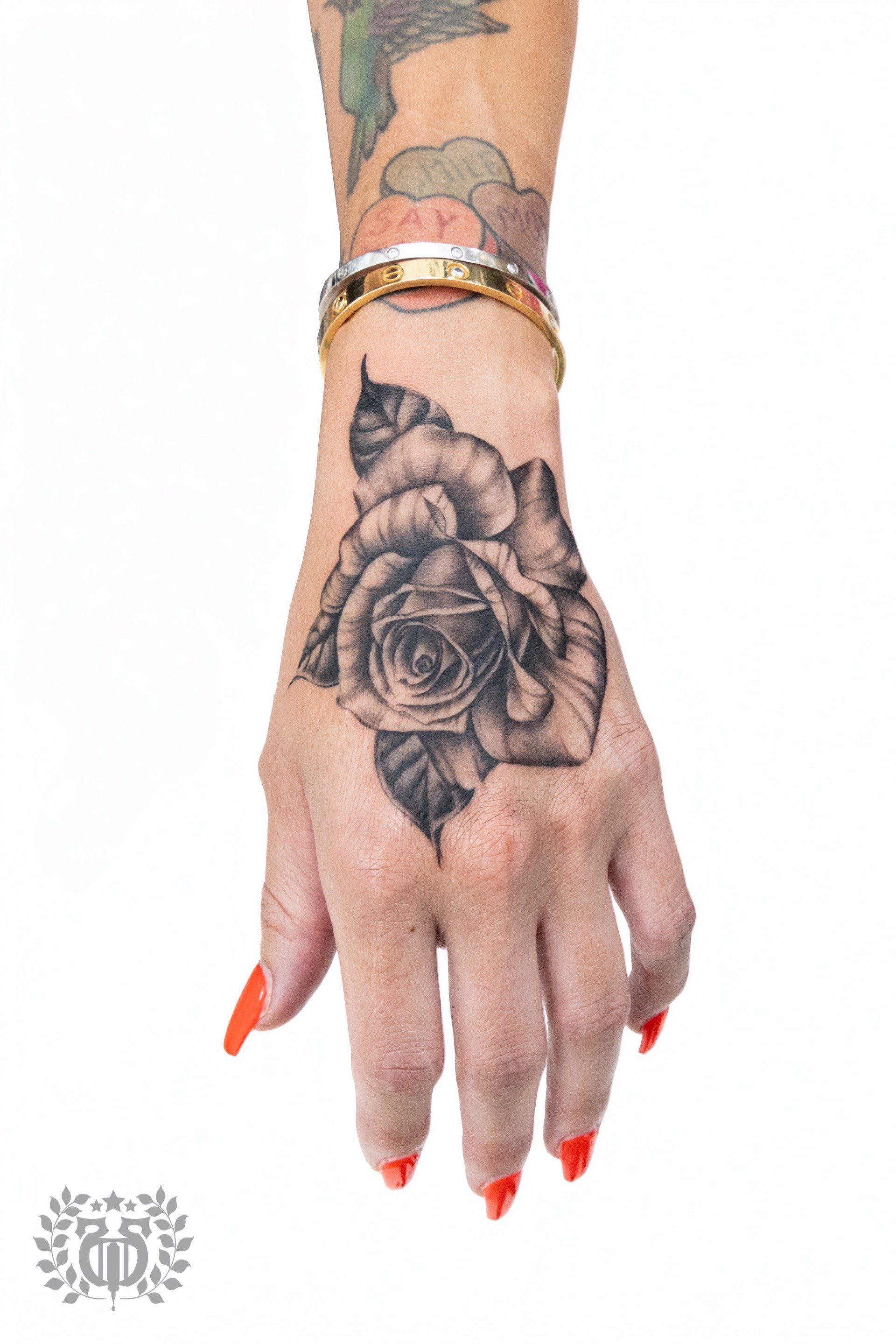 Black and grey realistic rose realism tattoo on hand in Los Angeles