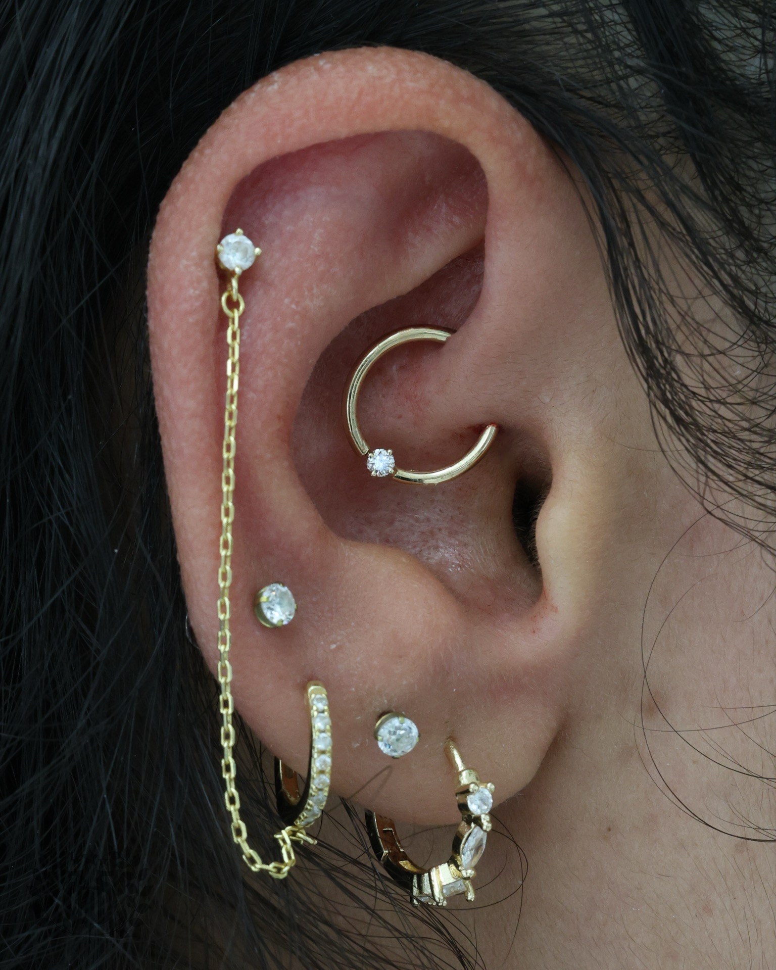 Daith hoop and stacked lobe piercing at Apollo Studio Los Angeles