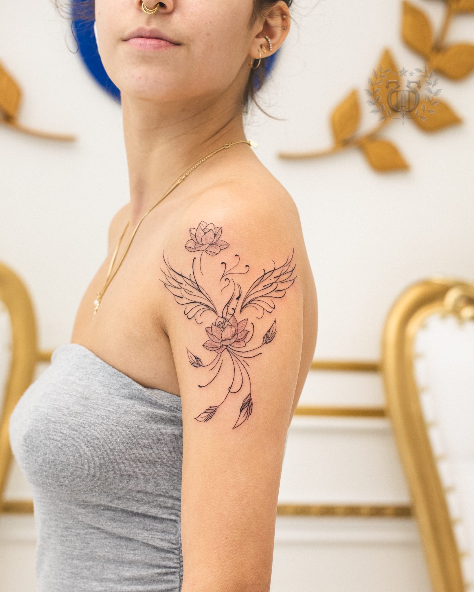 Fine line phoenix and lotus floral tattoo at Apollo Studio Los Angeles