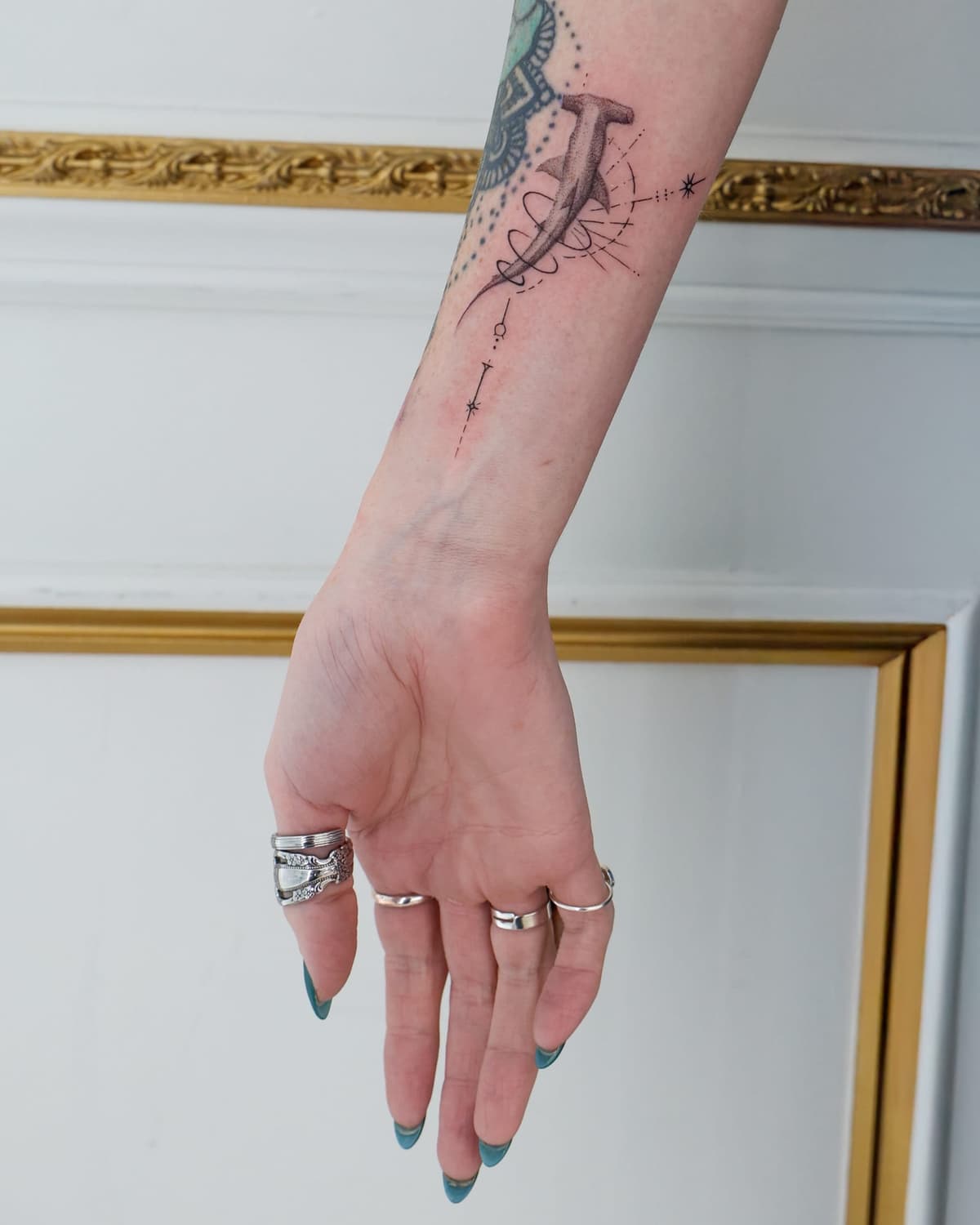 Fine line ornamental wrist tattoo at Apollo Studio Los Angeles