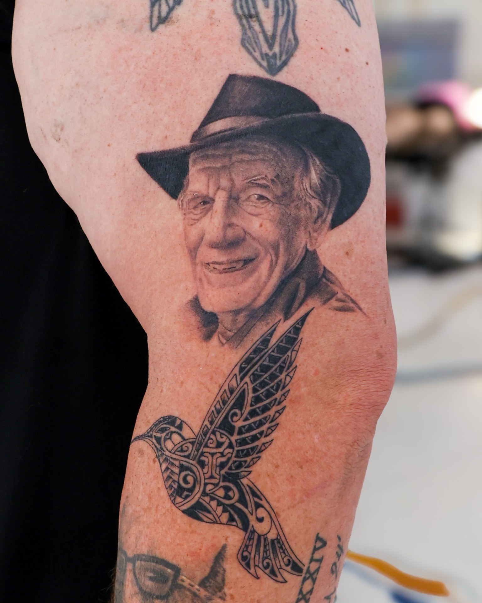 Black and grey realistic eyes realism tattoo on the forearm at Apollo Studio Los Angeles