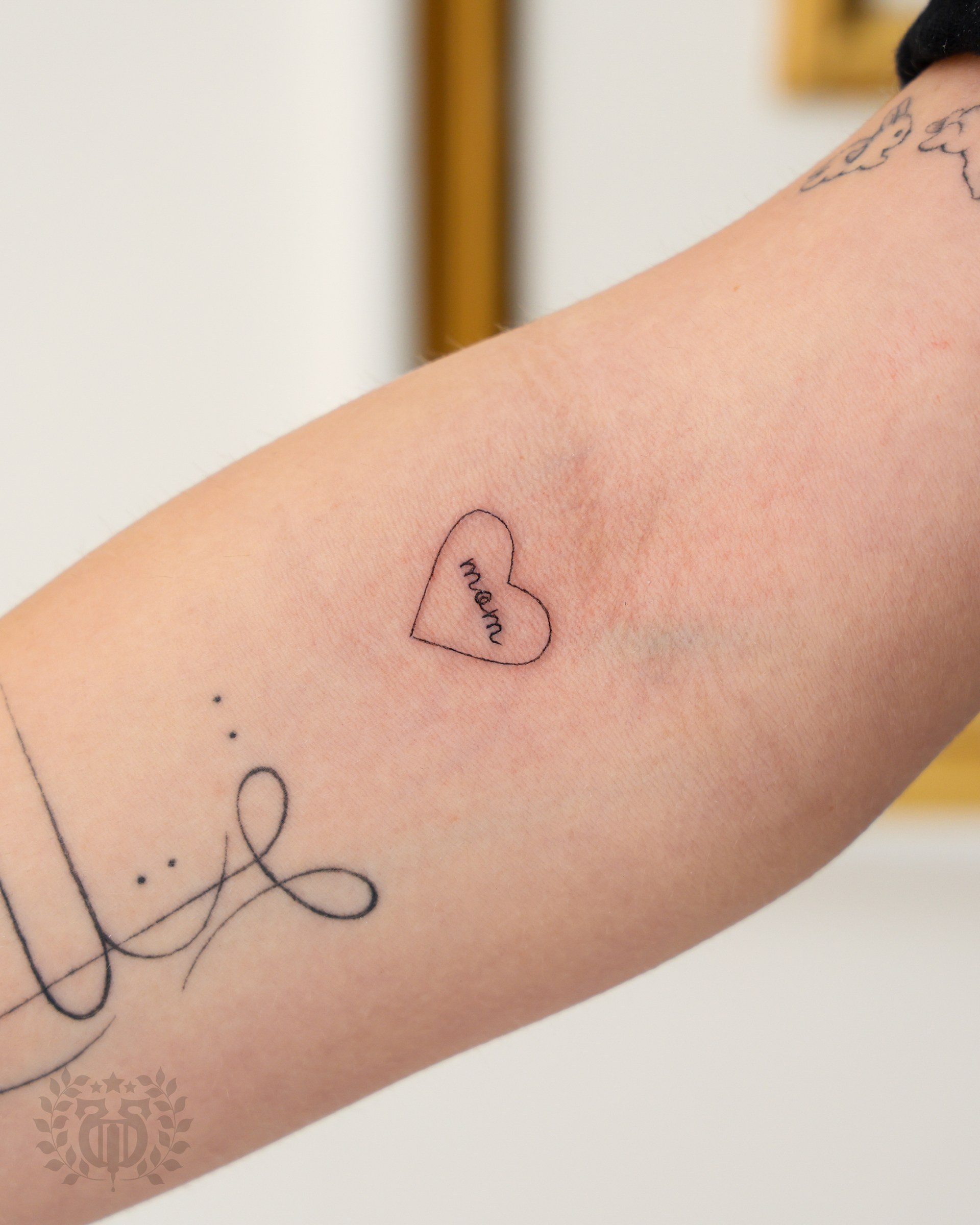Minimalist fine-line tattoo at Apollo Studio Los Angeles